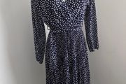 Never Worn. One size (10-14) J&amp;L Pleated dress with flattering crossover v-neck front