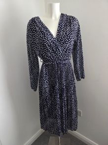 Never Worn. One size (10-14) J&L Pleated dress with flattering crossover v-neck front