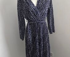 Never Worn. One size (10-14) J&L Pleated dress with flattering crossover v-neck front