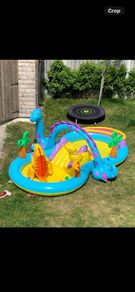 Dinosaur paddling pool with slide