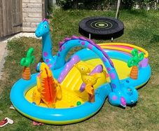 Dinosaur paddling pool with slide