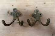 Two brass hooks