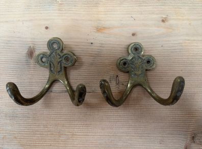 Two brass hooks