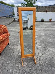 Full length mirror with accessory storage