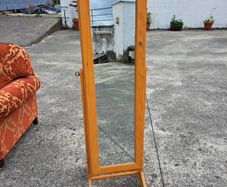 Full length mirror with accessory storage