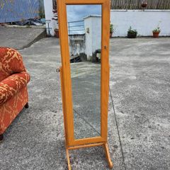 Full length mirror with accessory storage