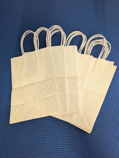 Small white paper bags