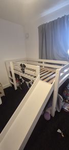 Mid sleeper bed with slide