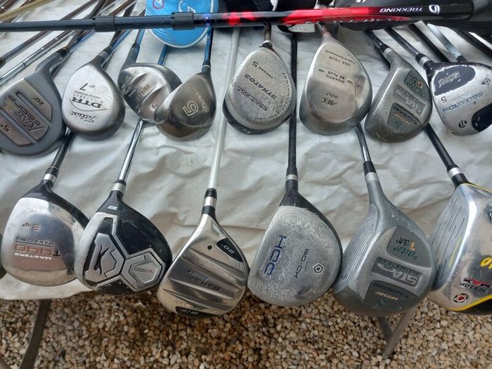 A selection of golf clubs and bags. NOT SELLING SEPARATE