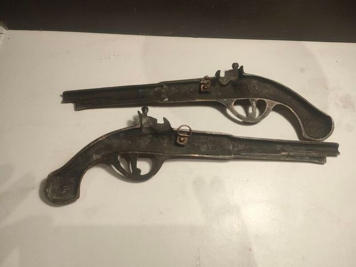 A pair of Early 20th Century 13" Brass Flintlock pistols