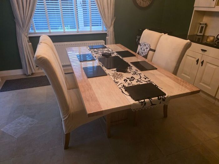 Marble table with 4 cream leather chairs