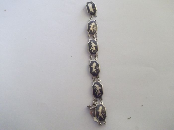 a vintage silver and enamel bracelet