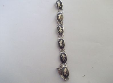 a vintage silver and enamel bracelet