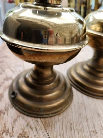 a lovely pair of old brass lamps