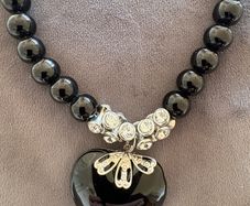 Black necklace with large black heart pendant