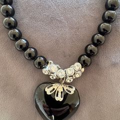 Black necklace with large black heart pendant