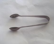 a antique solid silver suger tongs or nips