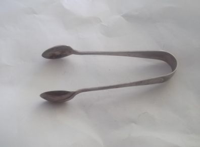 a antique solid silver suger tongs or nips