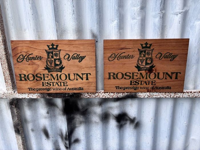 Matching pair of wooden wine plaques