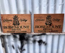 Matching pair of wooden wine plaques