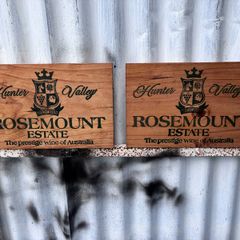 Matching pair of wooden wine plaques