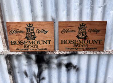 Matching pair of wooden wine plaques