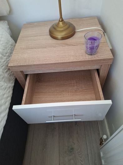 Timer and white wardrobe and bedside locker