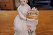 Vintage porcelain woman figurine detailed flowers