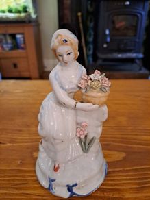 Vintage porcelain woman figurine detailed flowers