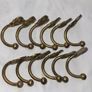 Patient brass coat hangers Image 2
