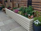 Custom timber garden fencing with integrated planters and bench Image 4