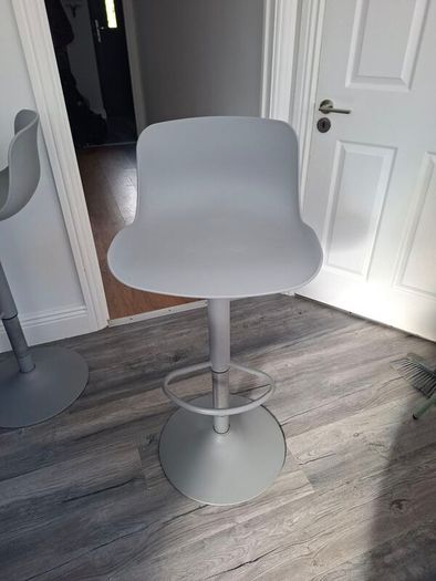 Two adjustable grey breakfast bar stools