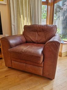 brown leather sofa and arm chair