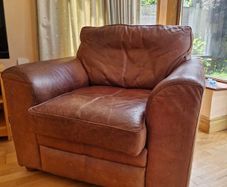 brown leather sofa and arm chair