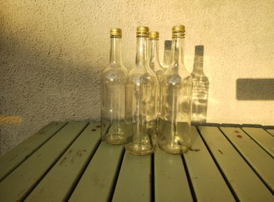 75cl Bottles. Clear glass. Contained apple Juice