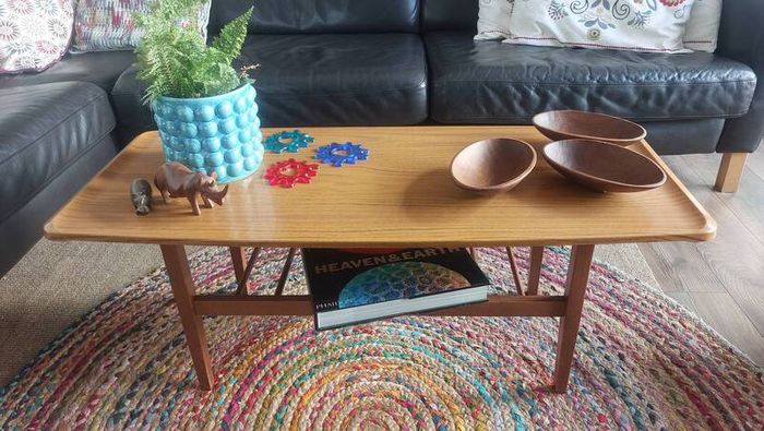 Unusual and Practical Mid-Century Modern Wooden Coffee Table with a Hard-Wearing Wood-Patterned Melamine Top and Slatted Magazine Shelf