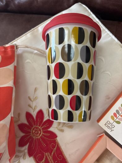 A Bundle of Orla Kiely Products - Bergamot Mini bath and hand set , a pull string wash bag, 2 empty body lotion and conditioner and a limited edition travel porcelain cup for Kenco