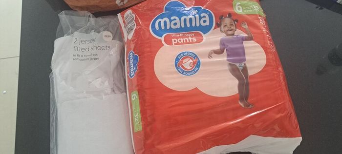 travel cot sheets and nappies