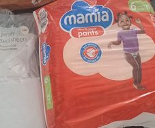 travel cot sheets and nappies