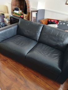 black leather two seater couch