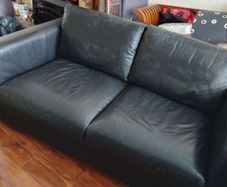black leather two seater