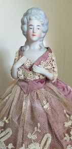 antique half pin doll with skirt