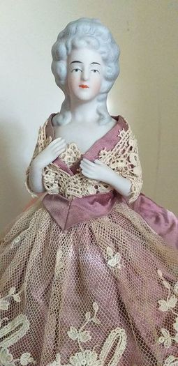 antique half pin doll with skirt