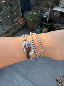 Leather and silver double wrap designer uno de 50 bracelet