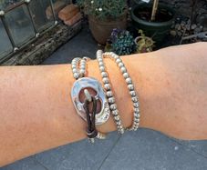 Leather and silver double wrap designer uno de 50 bracelet