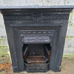 Fireplace surround and grate