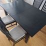 Black dining table with four chairs Image 2