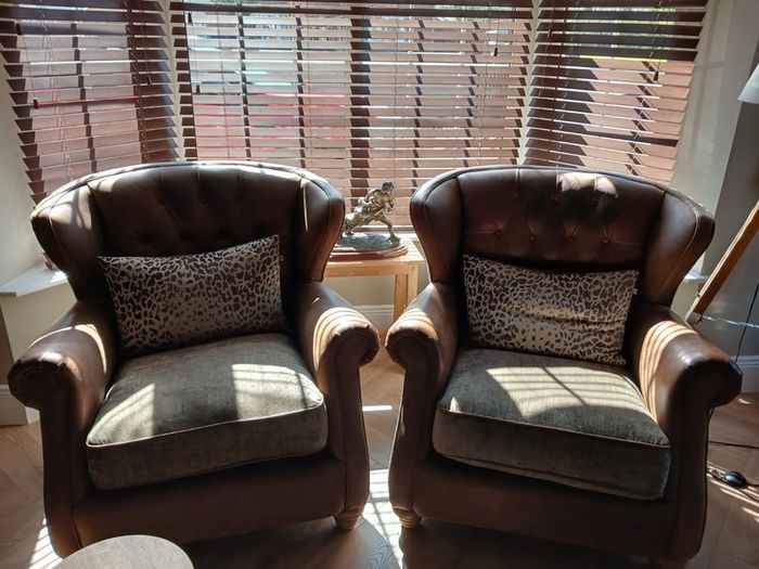 Chesterfield couch & 2 single chairs in brown leather and sage green cushions. Perfect condition,  non smokers, no house pets.  Couch Width 7ft, Depth 4ft. Chairs Width 3ft2ins, Depth 3ft