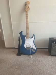 Blue Stratocaster with amp cables included