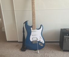 Blue Stratocaster with amp cables included